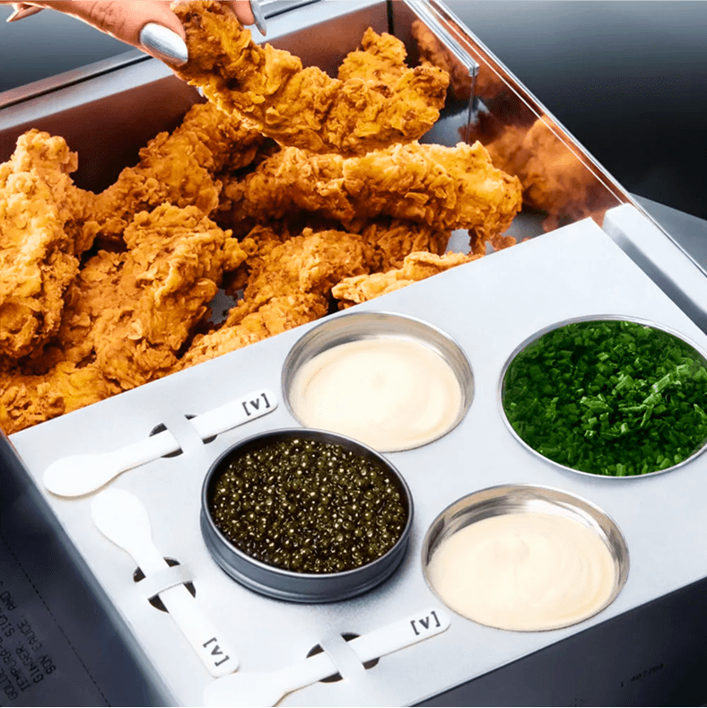 Tray of chicken tenders with various sauces